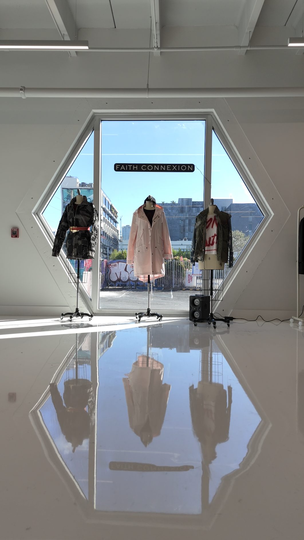 Faith Connexion window display in the hexagonal window at Encore Wynwood