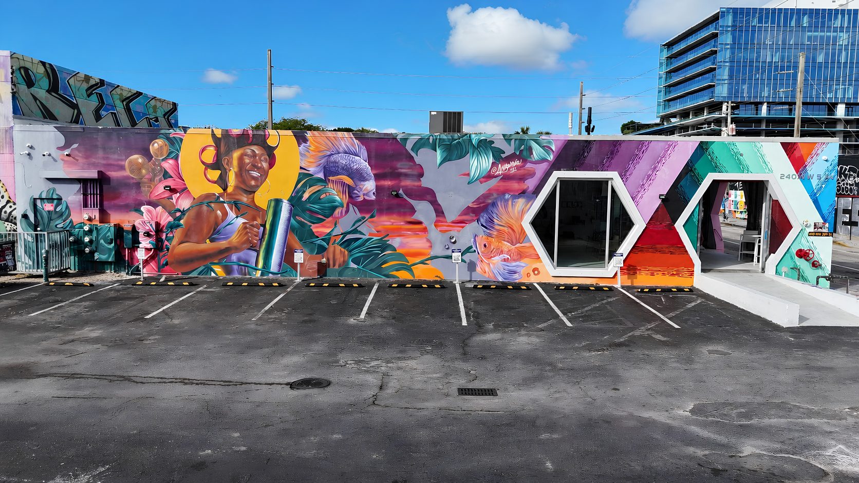 The mural wall inside the private parking lot at Encore Wynwood